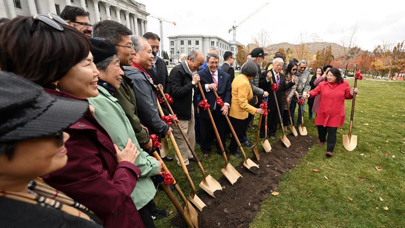 Members of the Chinese Railroad Workers Descendants Association and other leaders pose with shovels as they hold a groundbreaking for Utah’s first monument honoring Chinese railroad workers, at the Capitol in Salt Lake City on Tuesday. 