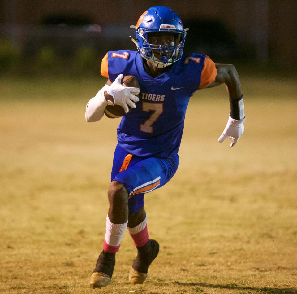 Jefferson County senior Juvon Pettway (7) rushes the ball in a game against FAMU DRS on Oct. 3, 2022, at Jefferson County High School. The Tigers won 36-12.