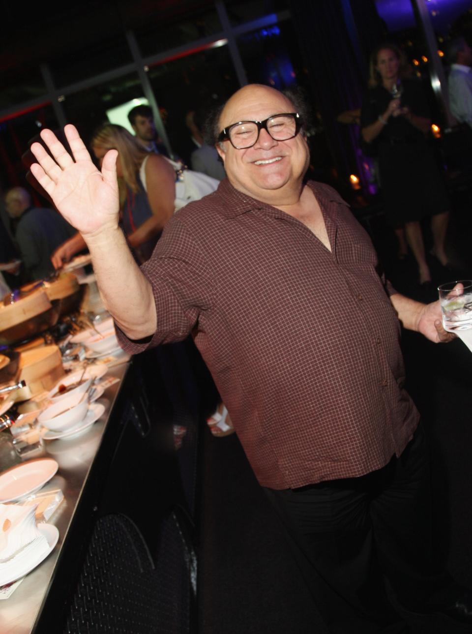 Danny DeVito waving