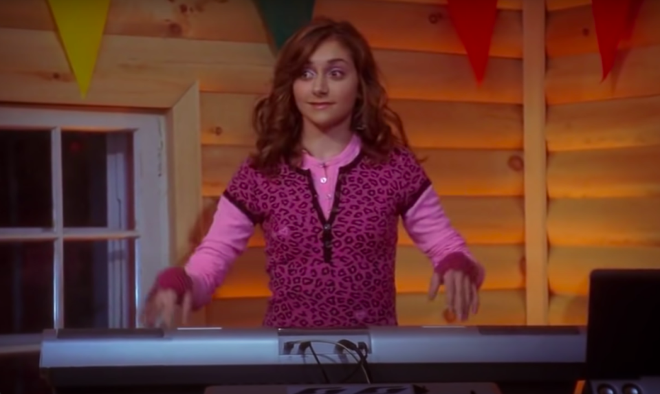 close up of alyson's character playing the keyboard