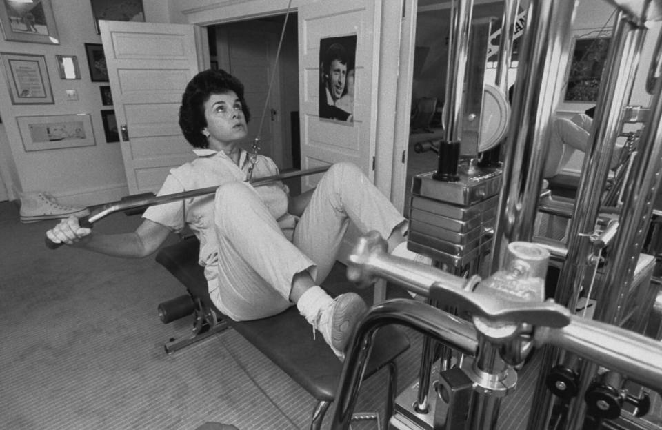 San Francisco Mayor & Dem. Gubernatorial hopeful Dianne Feinstein working out on weight machine at home.