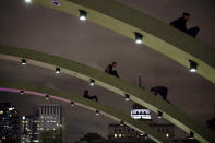 TORONTO, ON - JUNE 13: Toronto Raptors fans climb arches in front of Toronto City Hall as they celebrate the team beating the Golden State Warriors in Game Six of the NBA Finals, on June 13, 2019 in Toronto, Canada. (Photo by Cole Burston/Getty Images)