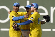 Boston Red Sox players, from left, Tommy Pham, Enrique Hernandez and Alex Verdugo celebrate after beating the Baltimore Orioles 5-3 in a baseball game, Thursday, Sept. 29, 2022, in Boston. (AP Photo/Steven Senne)