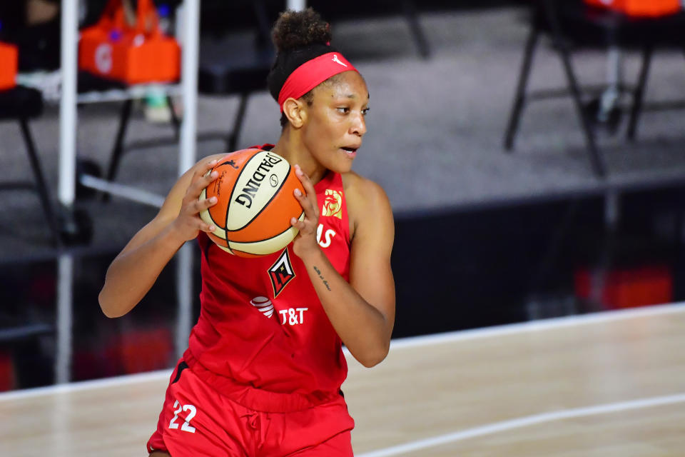 A'ja Wilson holds the ball. 