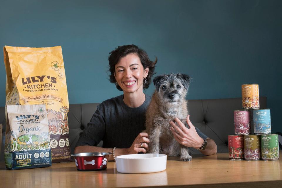 Food entrepreneurs are adroit at testing endless versions of their delicacies to hone their recipes — but tucking in to tins of dog food is a bit more unusual. Henrietta Morrison, though, does just that. “I’m such a believer in our food that I pop open a tin quite frequently in front of sceptical customers,” the creator of pet food business Lily’s Kitchen explains. “They can see that it’s clearly very different from other pet foods, which I wouldn’t dream of eating. It’s also the only way to properly test out the meals, and to feel the crunch of our new dry food — breaking it apart with your fingers just isn’t the same! Lots of us in the office happily munch away at it.”That dedication has paid dividends for Morrison’s business. She set up Lily’s Kitchen when her eponymous border terrier fell ill and refused to eat. Morrison was so worried that she cooked up a storm in the kitchen in a bid to tempt the pooch to regain her appetite. “Lily’s skin was covered in sores, so I started cooking meals for her with fresh lamb, lentils, vegetables, botanical herbs and blueberries,” Morrison explains. After 10 days, Lily made a full recovery. You or I might have put it down to a bug and gone back to serving up cheap tins of Dogalot again. Not Morrison: “I started to wonder what on earth I had been feeding her up to that point that had made her so ill,” she recalls. “After researching supermarket pet food, I realised there was an urgent need for proper food for pets in the market and, on my kitchen table, started Lily’s Kitchen.”Morrison, who is 50, remortgaged and used savings to raise an initial £150,000. “I spent the first two years talking to vets and nutritionists and visiting 30 pet food factories across Europe with recipes I’d developed in my own kitchen.”She was met with a lot of blank faces: “firstly, women in the pet food world are very unusual; secondly, they all used bone meal, a mixture of bone flour and oil, and had never used fresh meat before, let alone rosehips, apples and blueberries.” But when the economy sunk in 2008, manufacturers couldn’t afford to be fussy. “The recession meant a factory in Germany developed spare capacity. I persuaded them to make one pallet of seven dog recipes, including chicken and turkey casserole, which is still one of our most popular recipes.”That first pallet of 1500 tins were stocked by a Hampstead vet and a Primrose Hill pet shop. “At first, they were worried about the price, but then they phoned back, shocked, a few days later and said ‘it’s all sold! Can you bring back double the amount?’”At first, Morrison did all deliveries in her “tiny electric car”. When an early customer ordered 600 tins, “I drove back and forth 10 times with my car piled up with tins before they were all eventually stacked outside the house — and only then I rang the doorbell.”Nowadays, Lily and other canine customers can take their pick from a range of 70 dog foods that form part of Morrison’s £30 million-a-year pet food empire. There’s £2.50-a-serving “fishy fish pie” or “an English garden party” (that’s a tin of chicken, potatoes, spinach, carrots, “grain-free and nutritionally complete”).It isn’t Morrison’s first business: she set up a publishing firm after graduating, making student magazines and then a website for the gay community before selling the company in 2007. She took a year off, and enrolled on a garden design course aiming to become self-sufficient with fruit and veg — but then Lily got sick.Three years after launch, in 2011, Lily’s Kitchen had almost 1000 independent shops and vets stocking its food. Today it sells 50 million dog and cat meals a year. Fans include Ed Sheeran, Fearne Cotton and the Prince of Wales, who’s given Lily’s Kitchen a Royal Warrant.Morrison has just launched Woofbrushes “for ensuring your dog’s teeth are sparkling”. Her pet food, already sold in 12 countries including Spain, Holland, France and Italy, is spreading its wings, targeting the Middle East, South Korea and Hong Kong. And in the busy deal-making office, Lily snoozes and looks forward to another gourmet meal. “I definitely want to come back as a dog next time. That’s the life,” laughs Morrison. Lily’s Kitchen Founded: 2008Staff: 60Turnover: £30mBusiness idol: “Ben Cohen and Jerry Greenfield of Ben and Jerry’s Ice Cream — building a business based on fantastic product quality while also making a difference is the nirvana I find inspiring.”