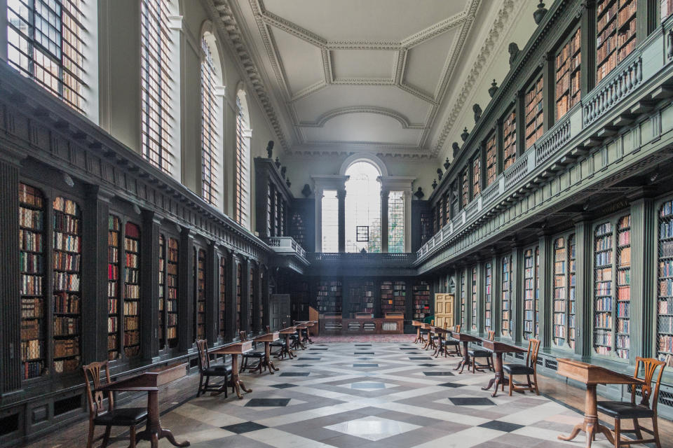 Interior of a green and white library in Oxford.