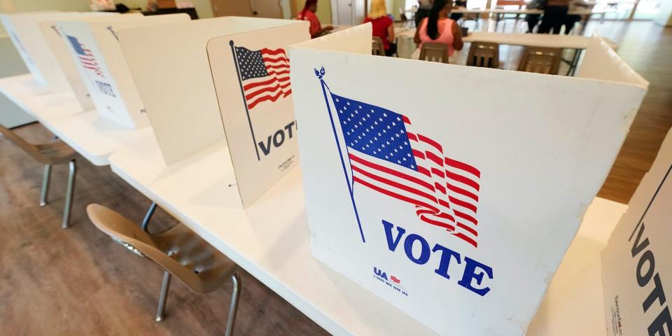 Empty poll kiosks await voters at the Mississippi Second Congressional District Primary election precinct, Tuesday, June 7, 2022, in Jackson, Miss