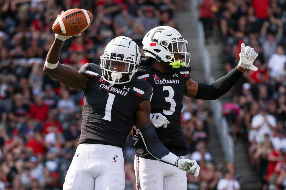 CINCINNATI, OHIO - SEPTEMBER 11: Ahmad Gardner #1 and Ja'von Hicks #3 of the Cincinnati Bearcats celebrate after Gardner made an interception in the second quarter against the Murray State Racers at Nippert Stadium on September 11, 2021 in Cincinnati, Ohio. (Photo by Dylan Buell/Getty Images)