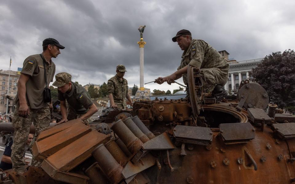 Ukrainian soldiers on a Russian tank that was destroyed in fights with the Ukrainian army, displayed on Khreshchatyk street, in downtown Kyiv, ahead of the 'Independence Day', Ukraine, 20 August 2022. Ukrainians will mark the 31st anniversary of Ukraine's independence from the Soviet Union in 1991, as the Russian invasion continues. Russian troops on 24 February entered Ukrainian territory, starting the conflict that has provoked destruction and a humanitarian crisis. Russian armoured military vehicles destroyed in fights with the Ukrainian army, displayed on Khreshchatyk street ahead of the 'Independence Day', Kyiv, Ukraine - 20 Aug 2022 - ROMAN PILIPEY/EPA-EFE/Shutterstock 