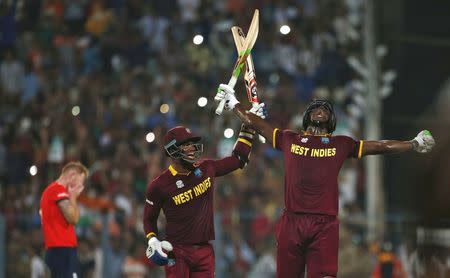 Cricket - England v West Indies - World Twenty20 cricket tournament final - Kolkata, India - 03/04/2016. West Indies Carlos Brathwaite (R) and Marlon Samuels celebrate after winning the final. REUTERS/Adnan Abidi