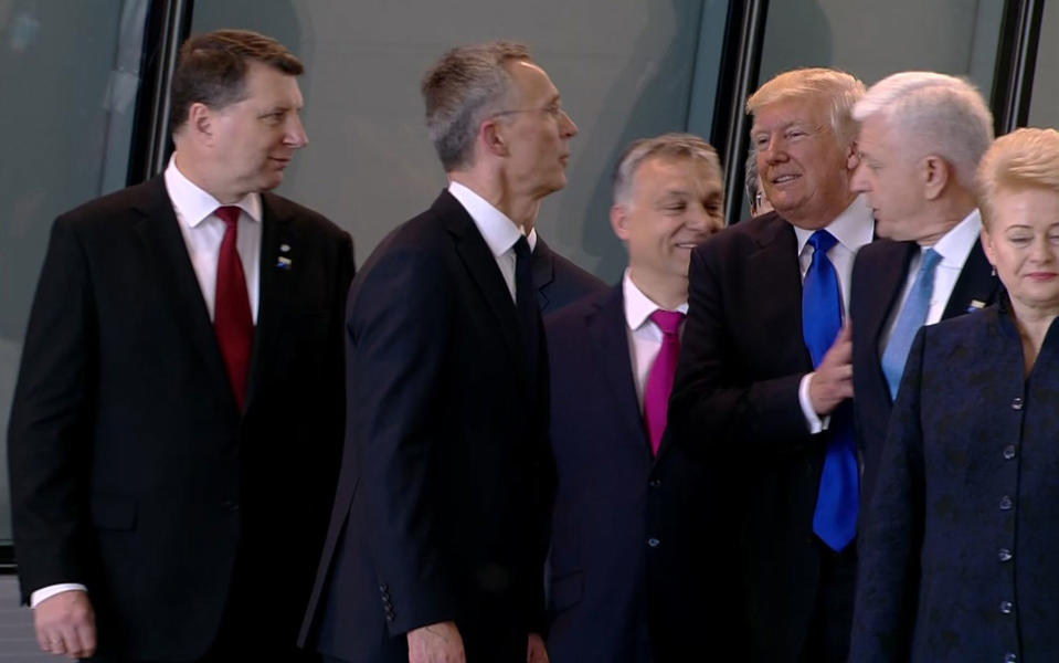 <p>In this image taken from NATO TV, Montenegro Prime Minister Dusko Markovic, second right, appears to be pushed by US President Donald Trump as they were given a tour of NATO’s new headquarters after taking part in a group photo, during a NATO summit of heads of state and government in Brussels on Thursday, May 25, 2017. (Photo: NATO TV via AP) </p>