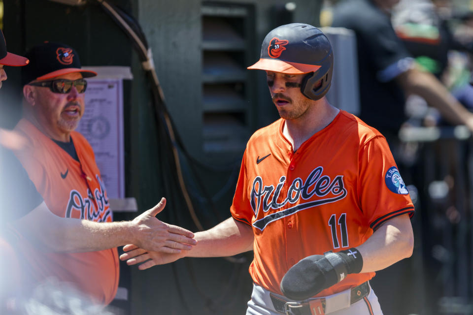 Baltimore Orioles' Jordan Westburg is congratulated after he scored against the Oakland Athletics during the fourth inning of a baseball game Saturday, July 6, 2024, in Oakland, Calif. (AP Photo/John Hefti)