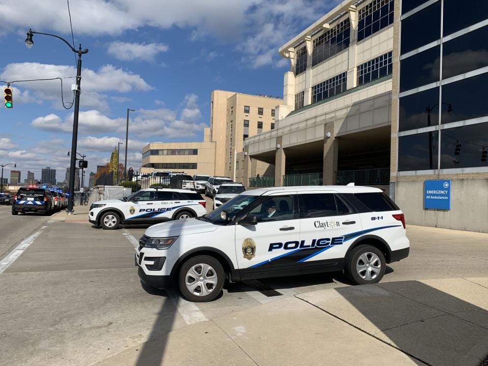 Dozens of officers and state troopers from across several cities in Montgomery and Greene counties gathered outside Miami Valley Hospital Tuesday as Officer Cody Cecil was released from Miami Valley Hospital five days after he was shot while serving a warrant in Clayton. (Scott Kessler/Staff)