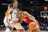 Ohio State forward Taylor Thierry (2) drives towards the basket as UConn guard Azzi Fudd (35) plays defense in the first quarter of a Sweet 16 college basketball game of the NCAA Tournament in Seattle, Saturday, March 25, 2023. (AP Photo/Caean Couto)