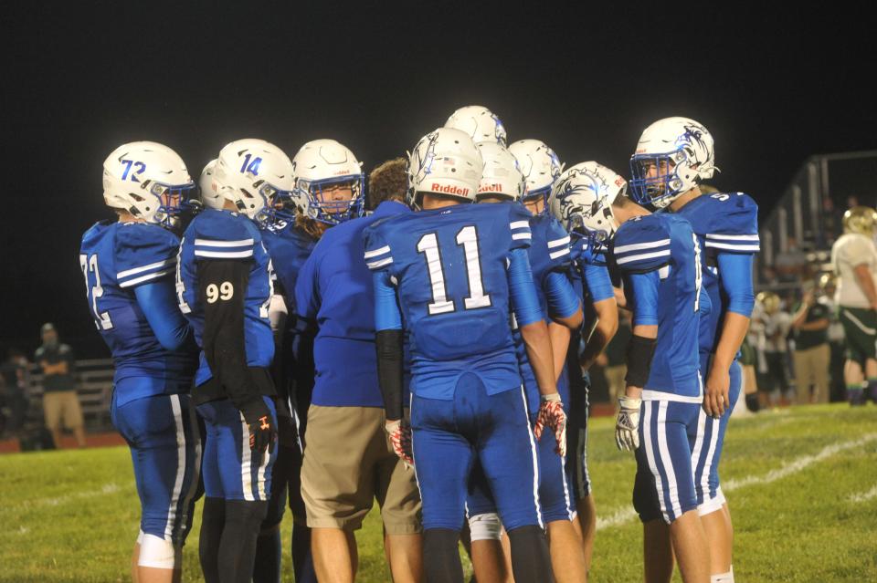 Crestline coach Jonny King talks to his team during a timeout.