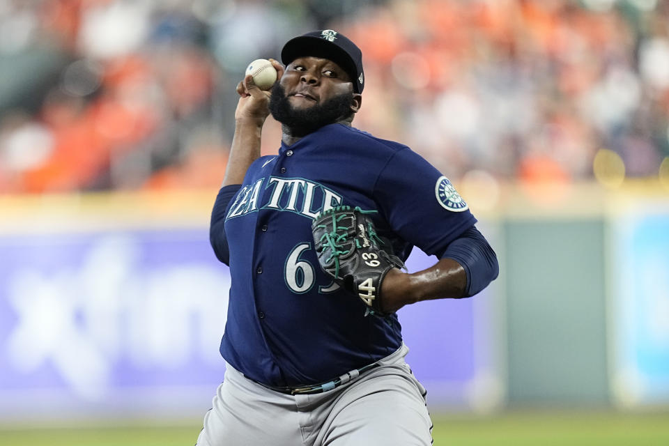 FILE -Seattle Mariners relief pitcher Diego Castillo (63) delivers a pitch against the Houston Astros during the seventh inning in Game 1 of an American League Division Series baseball game in Houston, Tuesday, Oct. 11, 2022. Reliever Diego Castillo and the Seattle Mariners went to salary arbitration Tuesday, Jan. 31, 2023 with the pitcher asking for $3,225,000 and the team offering $2.95 million.(AP Photo/Kevin M. Cox, File)