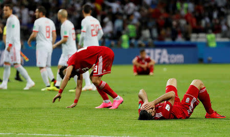 Soccer Football - World Cup - Group B - Iran vs Spain - Kazan Arena, Kazan, Russia - June 20, 2018 Iran players look dejected after the match REUTERS/Toru Hanai