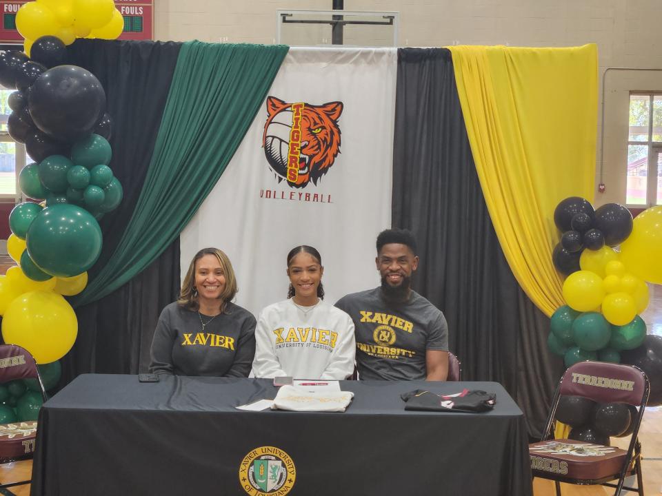 Alaysia Miller of Terrebonne High School with her parents shortly after signing to play college volleyball at Xavier University of Louisiana.