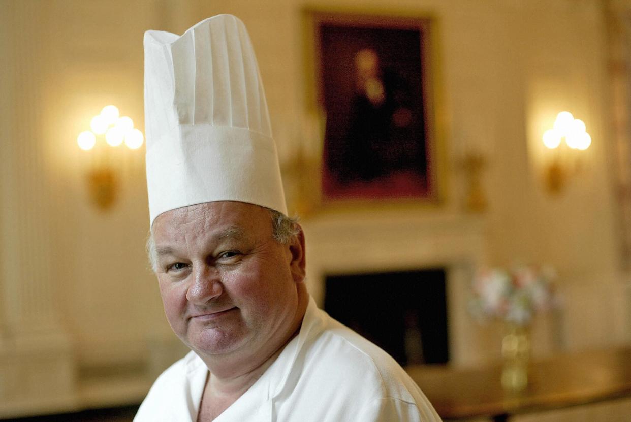 White House pastry chef Roland Mesnier from Bonnay, France, poses in the State Dining Room of the White House 14 June, 2004, in Washington, DC. Mesnier, 60, announced he will retire from his post at the White House 30 July, 2004, after 25 years of service.