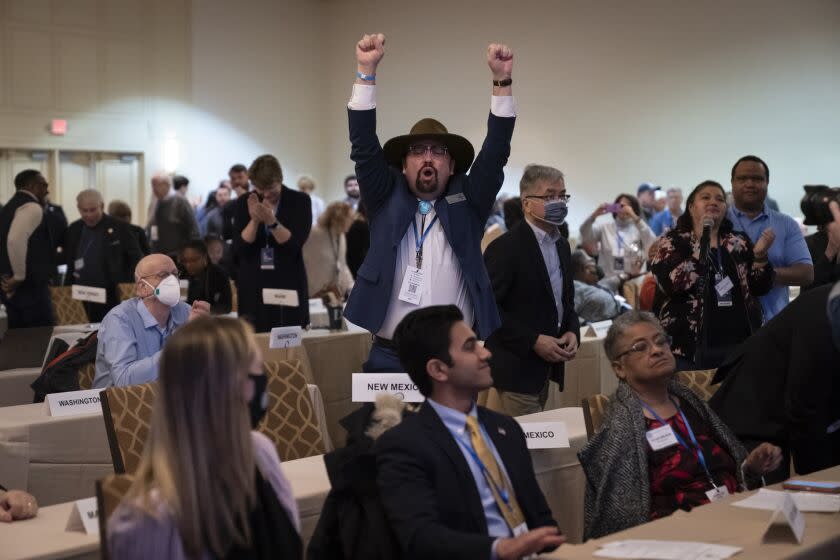 Committee member Manny Crespin of New Mexico reacts after a vote for new calendar lineup for the early stages of the party's presidential nominating contests during the Democratic National Committee Winter Meeting, Saturday, Feb. 4, 2023, in Philadelphia. (AP Photo/Matt Rourke)