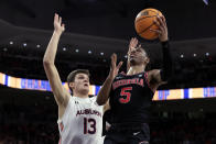 Georgia guard Christian Wright (5) shoots as Auburn forward Walker Kessler (13) defends during the first half of an NCAA college basketball game Wednesday, Jan. 19, 2022, in Auburn, Ala. (AP Photo/Butch Dill)