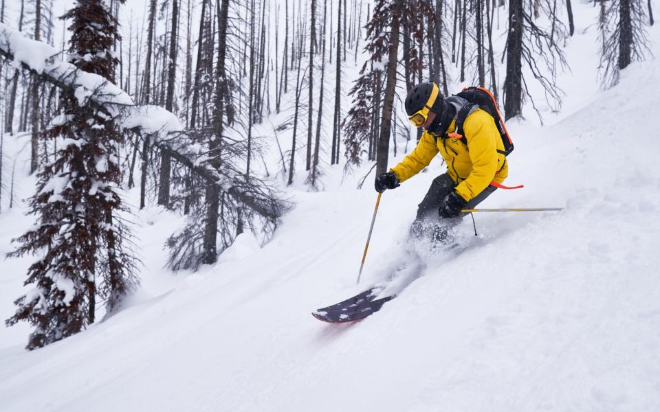 A man skiing on dusty ground