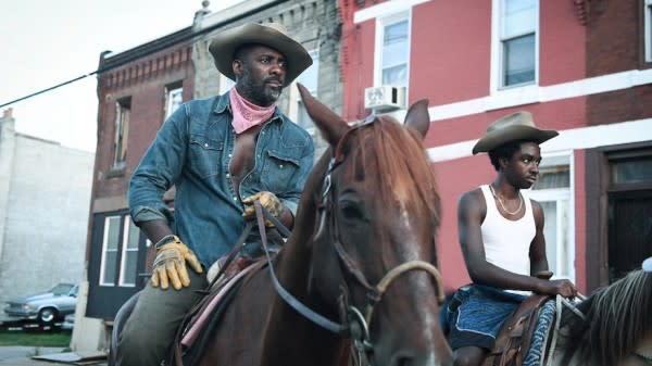 Idris Elba, left, and Caleb McLaughlin in Ricky Staub's "Concrete Cowboy"