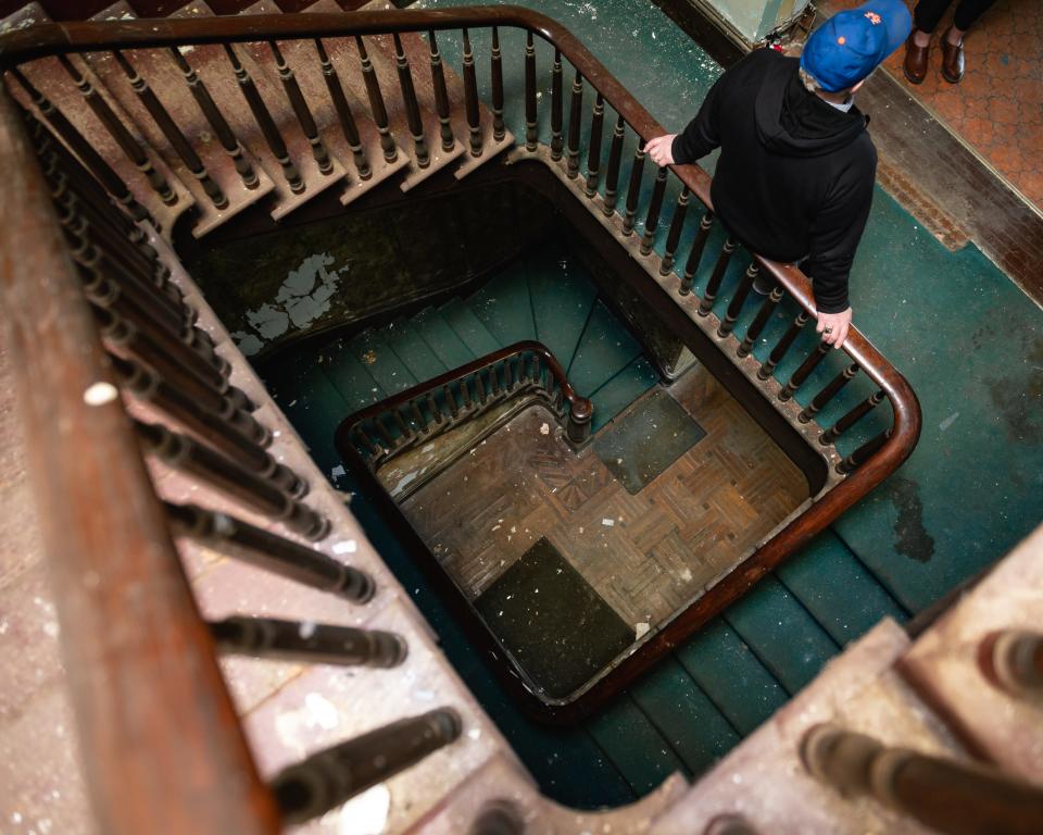 A interior view of the grand staircase of No. 1 Rutger Park in Utica on Friday, April 19, 2024.