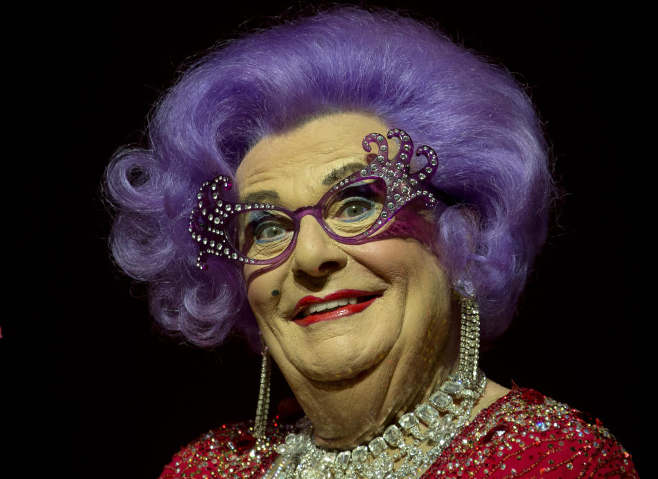 FILE - Australian TV presenter Barry Humphries performs on stage as Dame Edna for the Farewell Tour, at the London Palladium theatre, in central London, on Nov. 13, 2013. Tony Award-winning comedian Barry Humphries, internationally renowned for his garish stage persona Dame Edna Everage, a condescending and imperfectly-veiled snob whose evolving character has delighted audiences over seven decades, died on Saturday, April 22, 2023, after spending several days in a Sydney hospital with complications following hip surgery, a Sydney hospital said. He was 89 years old. (Photo by Joel Ryan/Invision/AP, File)