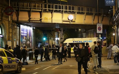 Police at the scene outside Parsons Green Tube station in London where three men have been stabbed - Credit: Yui Mok/PA