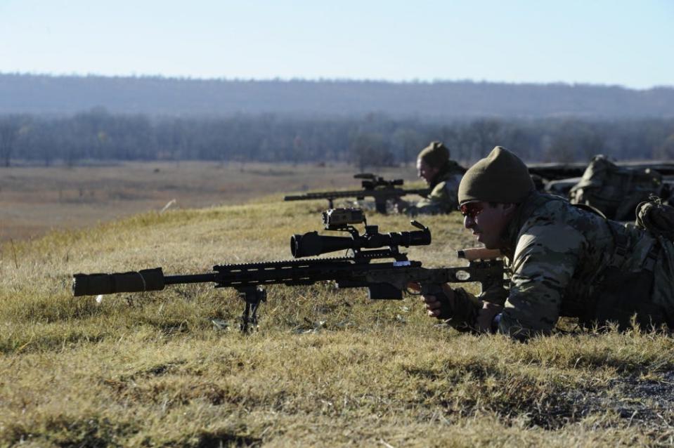 Sniper teams put rounds down range.