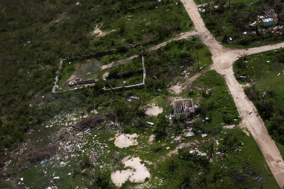 Houses are seen in ruins in Codrington on the island of Barbuda just after a month after Hurricane Irma struck the Caribbean islands of Antigua and Barbuda