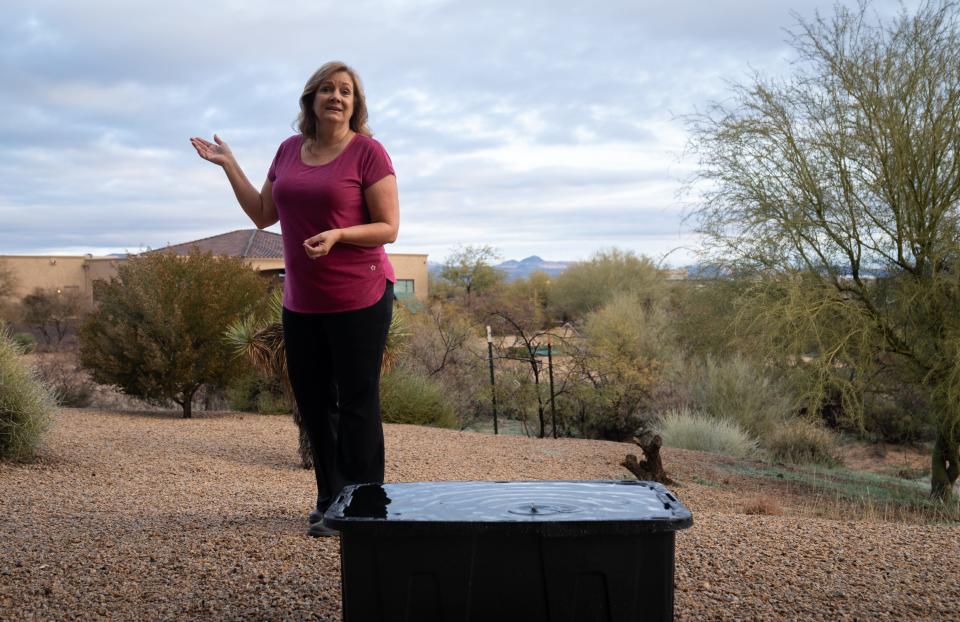 A portrait of Karen Nabity on Dec. 29, 2022, at her property in Rio Verde Foothills, Ariz. Nabity collects rainwater for use in her home.