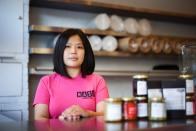 Mandy Yin poses inside Nasi Economy Rice, the takeaway shop she owns, amid the coronavirus disease (COVID-19) outbreak, in North London