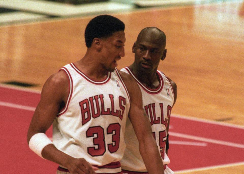 Mar 30, 1995; Chicago, IL, USA; Chicago Bulls guard Michael Jordan (45) talks with forward Scottie Pippen (33) after a timeout from the game against the Boston Celtics at Chicago Stadium. The Bulls beat the Celtics 100-82. Mandatory Credit: Matthew Emmons-USA TODAY Sports