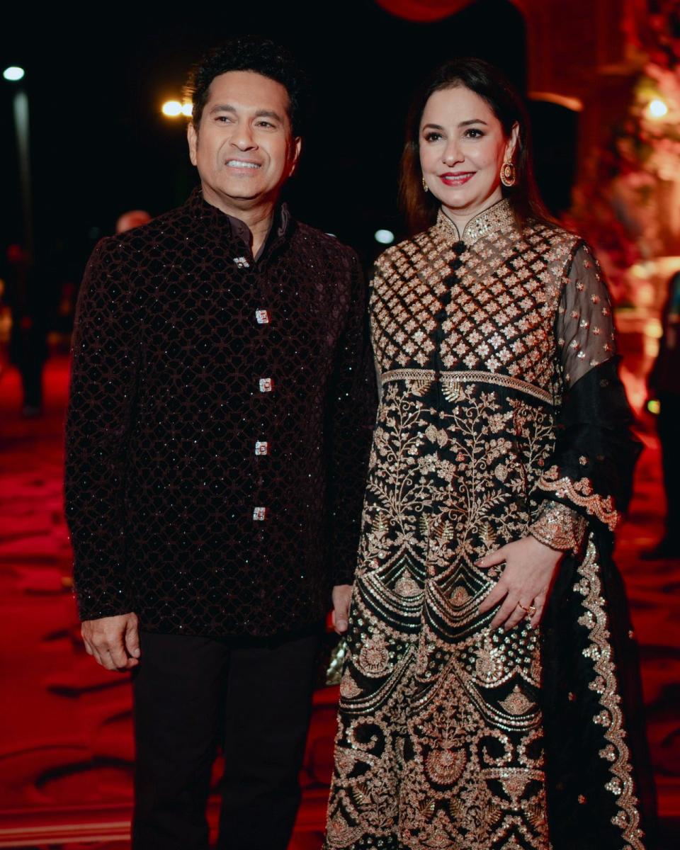 This photograph released by the Reliance group shows Indian cricketer Sachin Tendulkar posing for a photograph with his wife Anjali at a pre-wedding bash of billionaire industrialist Mukesh Ambani's son Anant Ambani in Jamnagar, India, Saturday, Mar. 02, 2024.