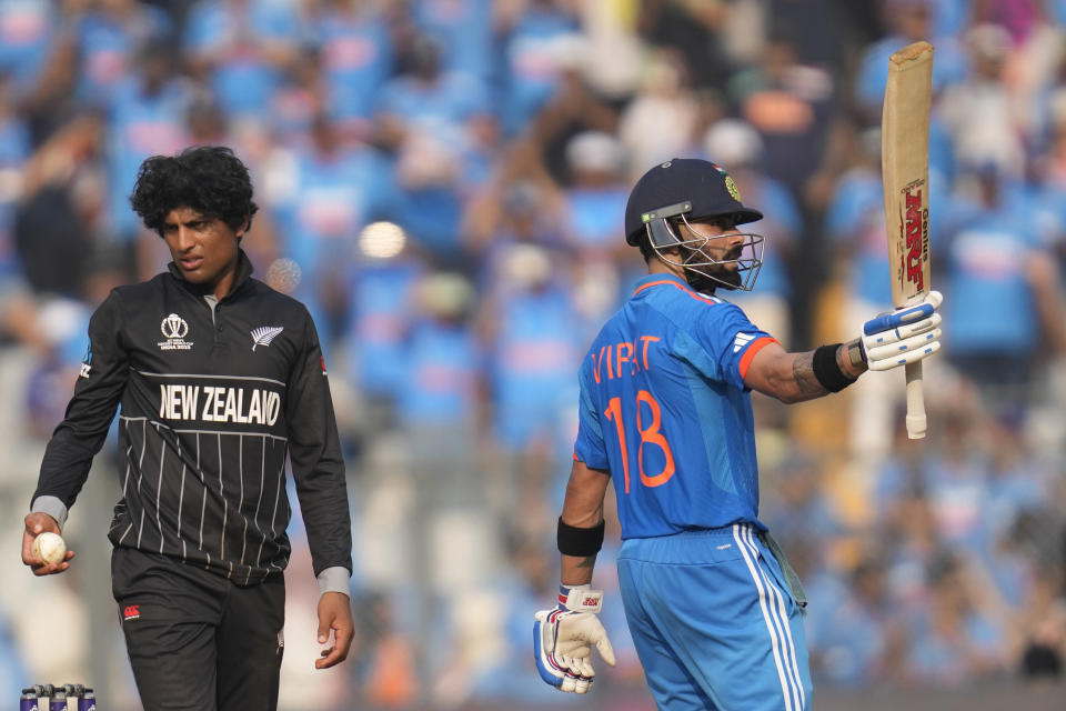 India's Virat Kohli celebrates his fifty runs during the ICC Men's Cricket World Cup first semifinal match between India and New Zealand in Mumbai, India, Wednesday, Nov. 15, 2023. (AP Photo/Rafiq Maqbool)