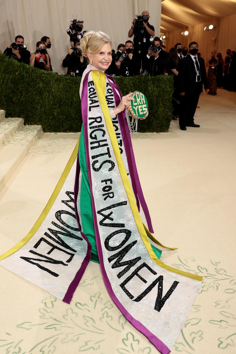 Carolyn B. Maloney wears a dress that says "equal rights for women" on it.