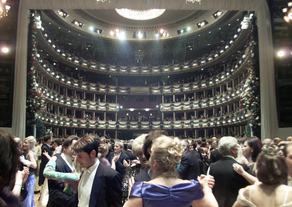 FILE - In this Thursday, Feb. 7, 2002 file photo, dancers crowd the dance floor during the traditional Viennese Opera Ball in the Vienna State Opera House, Austria. Fundamental change is underway in Europe, as crisis bites and voters revolt at the polls. An entire way of life is under threat as hard times take a toll in areas that have long been central to the continent’s view of itself: state protections; sophisticated lifestyle; shiny infrastructure; health care; a secure retirement; and more broadly, a sense of being the world’s elite. (AP Photo/Ronald Zak, file)