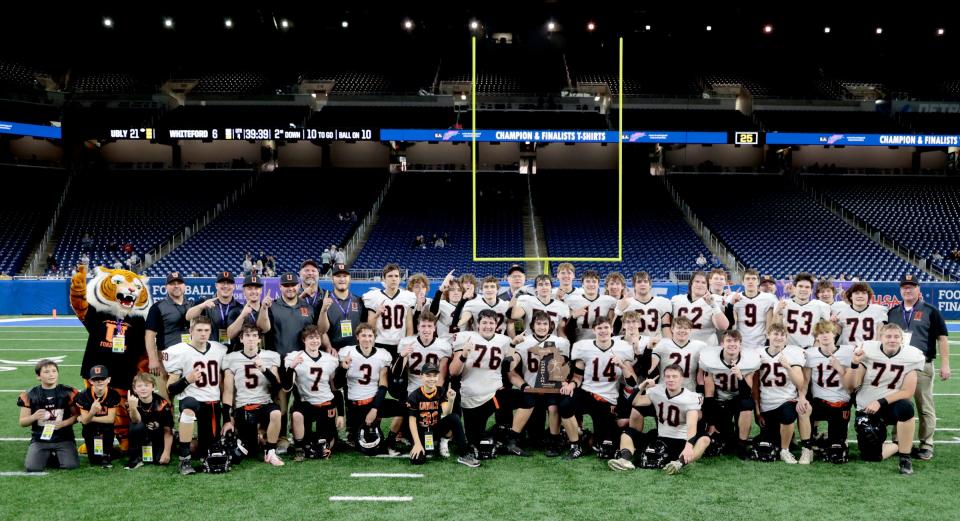 The Ubly football team poses for their group picture after the 21-6 win in the MHSAA Division 8 football state championship game on Saturday, Nov. 25, 2023, at Ford Field.