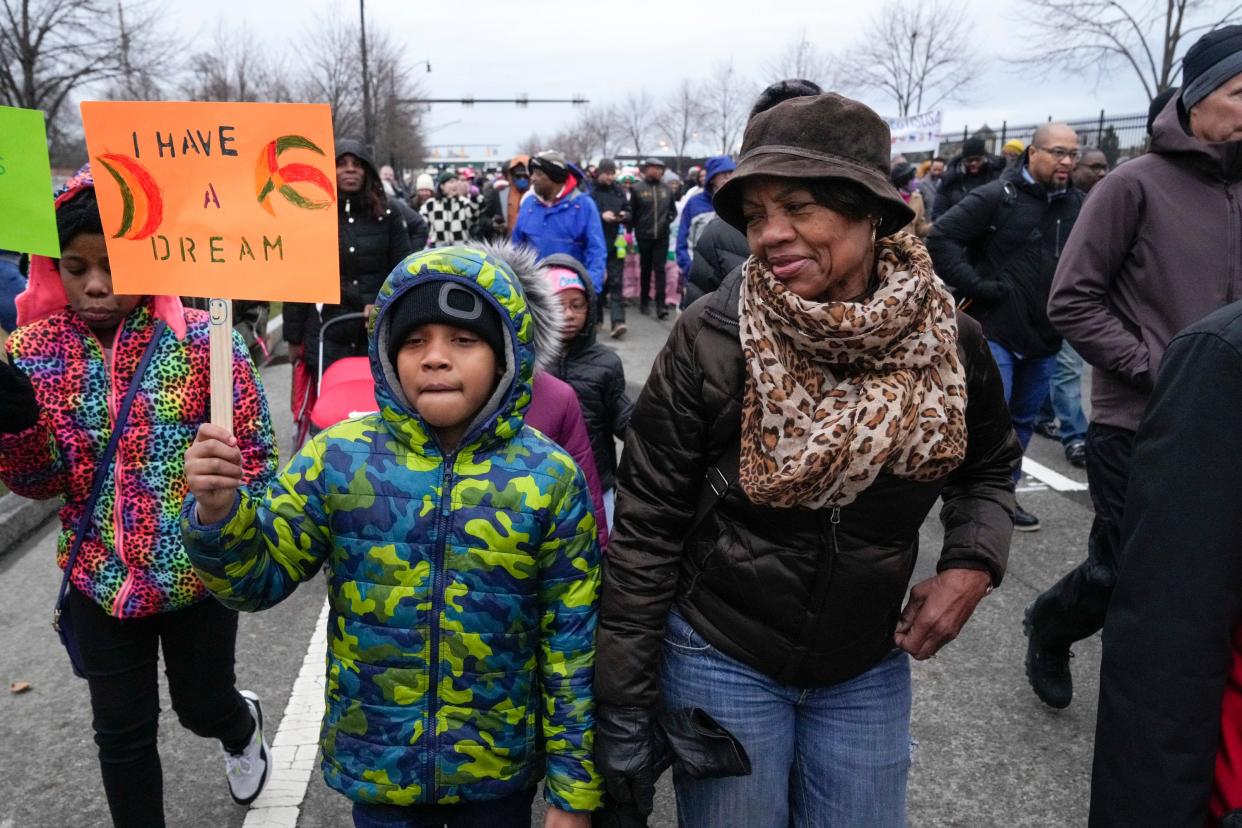 Aretha Anderson, right, of Columbus' North Side, smiles while looking at her 8-year-old grandson, Royal Simons, on Monday during Columbus' 2023 Martin Luther King Jr. march. “I think it’s important for all nationalities to join together and to make this a better place in life,” Anderson said.