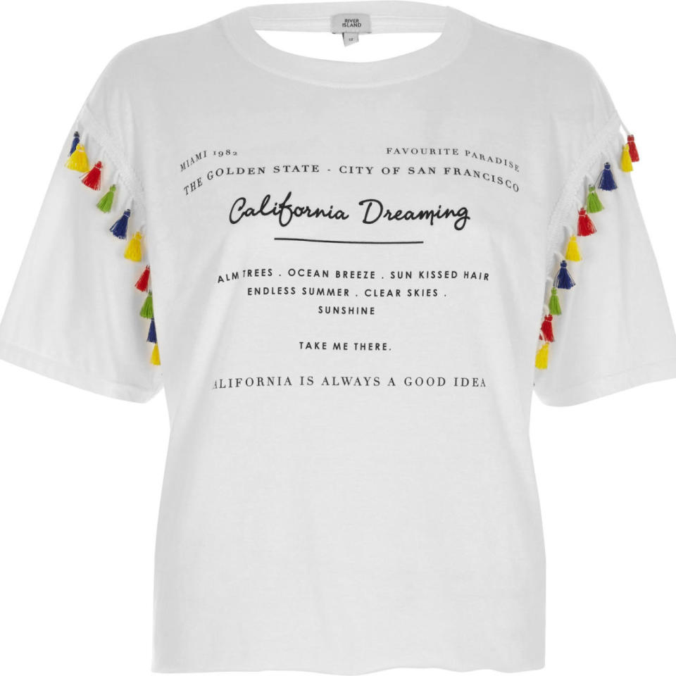 <p>White 'California' print tassel trim T-shirt. Available at <a rel="nofollow noopener" href="https://www.riverisland.com/p/white-california-print-tassel-trim-t-shirt-706509" target="_blank" data-ylk="slk:River Island - £20;elm:context_link;itc:0;sec:content-canvas" class="link ">River Island - £20</a></p>