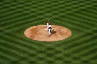 Philadelphia Phillies' Aaron Nola pitches during the first inning of an opening day baseball game against the Atlanta Braves, Thursday, April 1, 2021, in Philadelphia. (AP Photo/Matt Slocum)