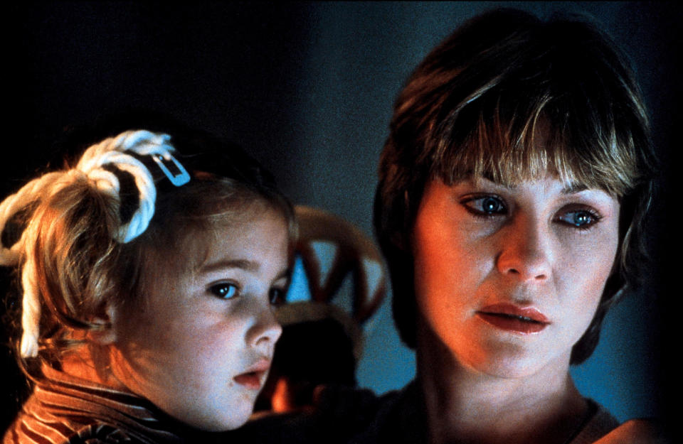 A young Drew Barrymore as Gertie is held by her on-screen mom, Dee Wallace, who played Mary Taylor in the film 