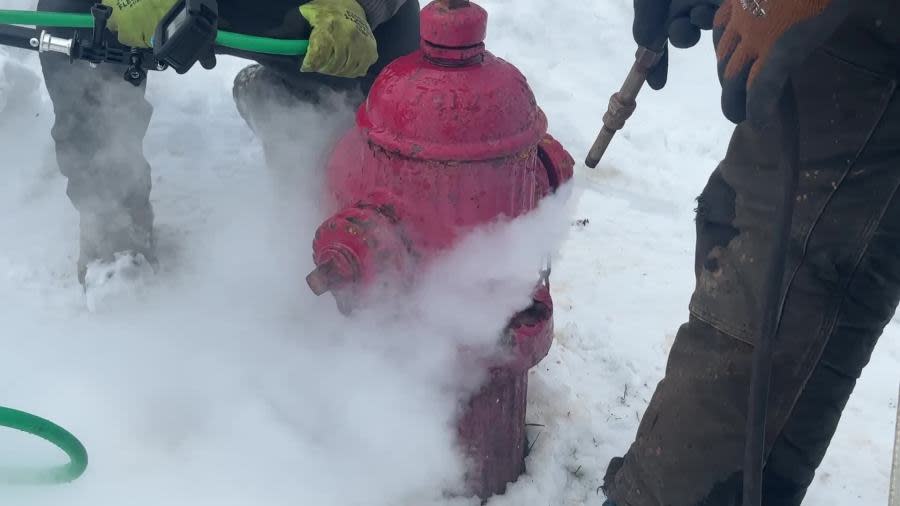 City workers thaw a fire hydrant in Muskegon on Jan. 22, 2024.