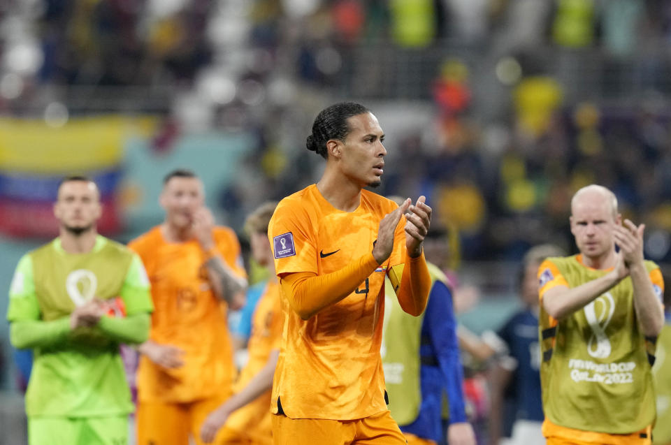 Virgil van Dijk of the Netherlands and teammates clap hands as they acknowledges their supporters at the end of the World Cup group A soccer match between Netherlands and Ecuador, at the Khalifa International Stadium in Doha, Qatar, Friday, Nov. 25, 2022. (AP Photo/Themba Hadebe)