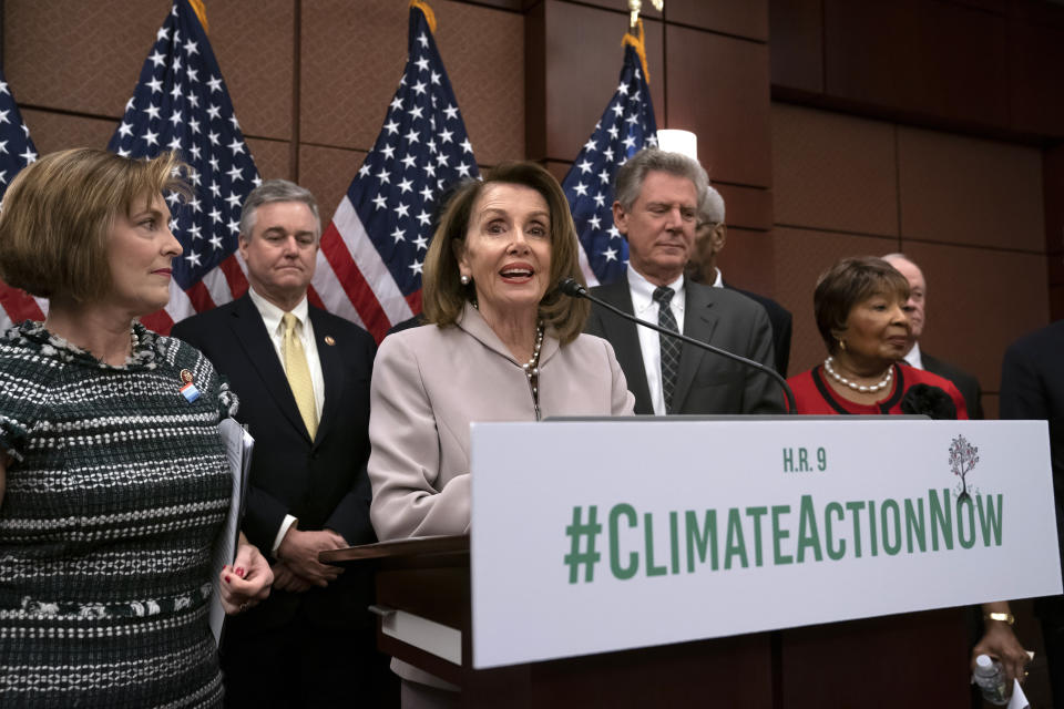 FILE - In this March 27, 2109, file photo, House Speaker Nancy Pelosi, D-Calif., speaks at an event to introduce the "Climate Action Now Act," at the Capitol in Washington, Wednesday, March 27, 2019, as, from left, Rep. Kathy Castor, D-Fla., who will chair the House Select Committee on the Climate Crisis, Rep. David Trone, D-Md., House Energy and Commerce Chairman Frank Pallone, D-N.J., and Science, Space and Technology Chairwoman Eddie Bernice Johnson, D-Texas, listen. The Democratic-controlled House has approved legislation that would prevent President Donald Trump from following through on his pledge to withdraw the U.S. from a landmark global climate agreement. (AP Photo/J. Scott Applewhite, File)