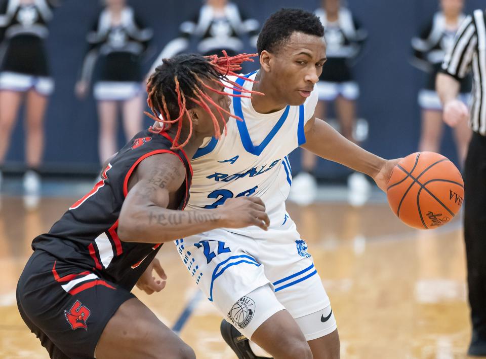 CVCA’s Darryn Peterson brings the ball down court against Shaw’s Damarion Logan during a Division II district semifinal Thursday, March 2, 2023, at Louisville.