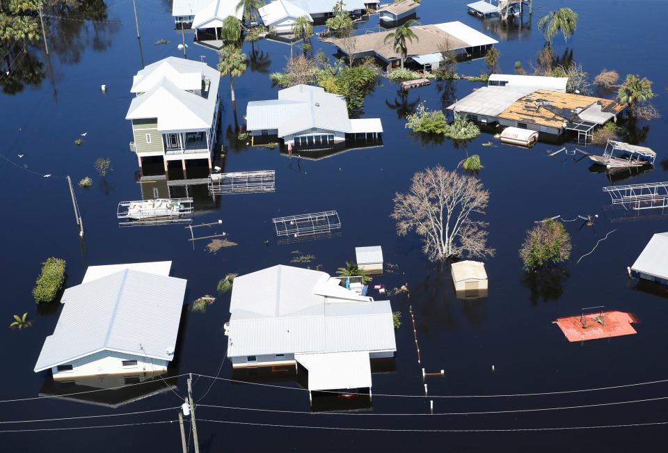 Homes are flooded by the rising waters of the Peace River east of North Point, Fla., after Hurricane Ian on Sept. 30.