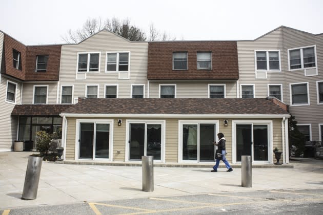 A worker arrives at Sanborn Place, in Reading, Mass. (Alana Semuels)